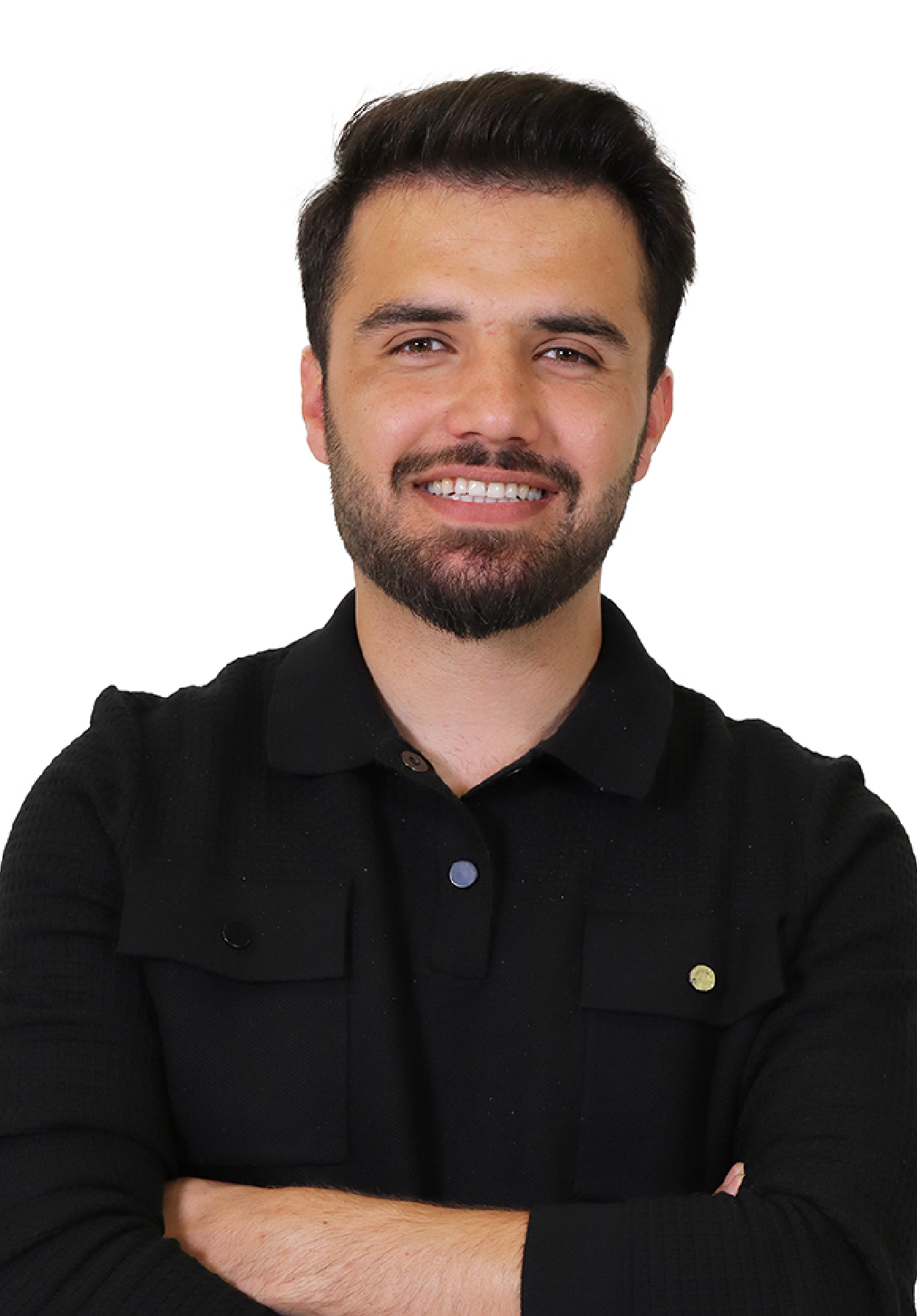 Shoukat in a black shirt folding his arms smiling